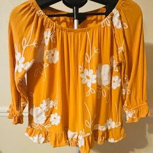 Gold/yellow top with white embroidered flowers